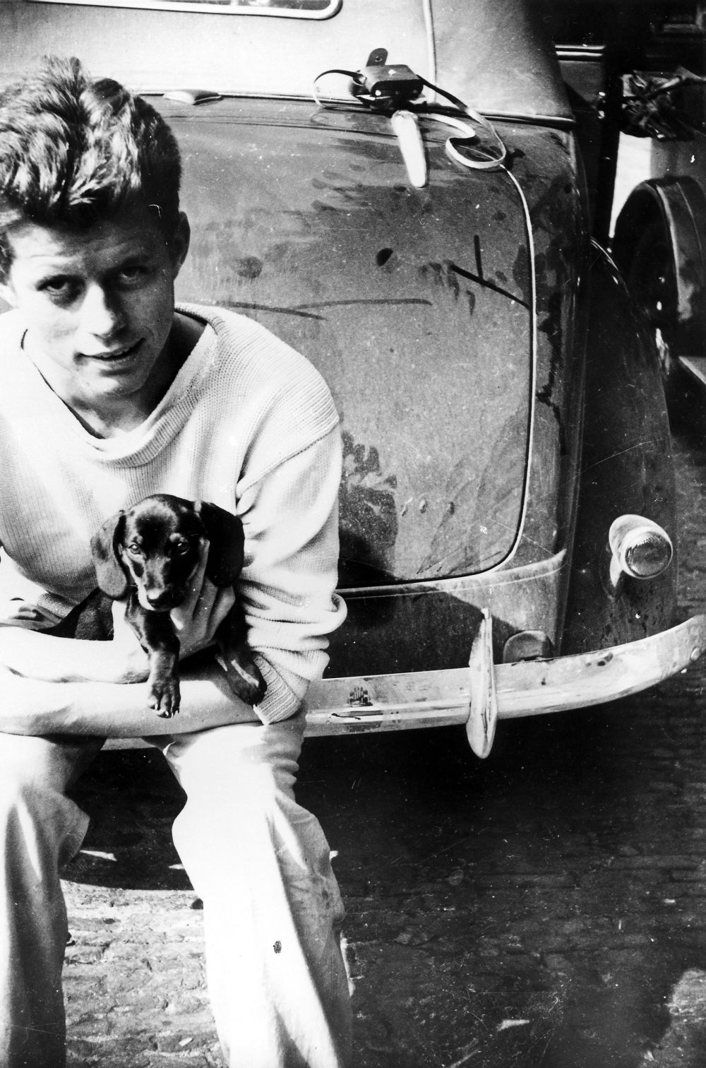 John F.Kennedy touring Europe with his canine friend