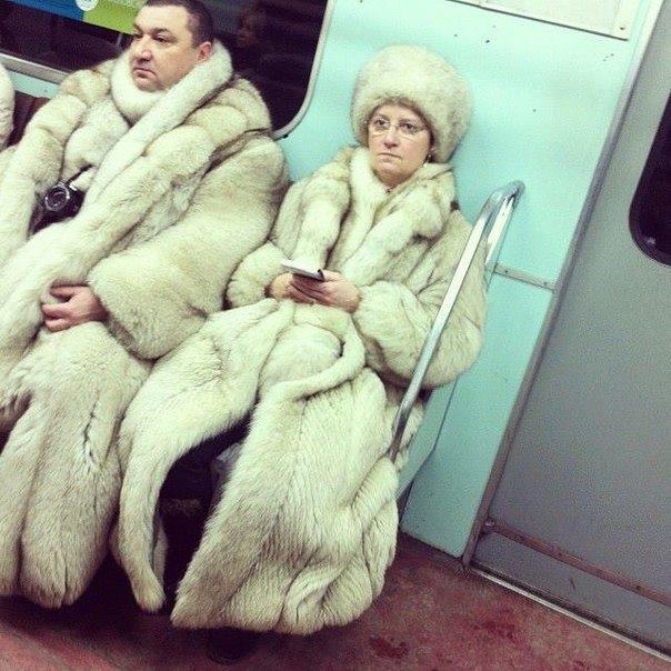 russian subway - couple in fur coats