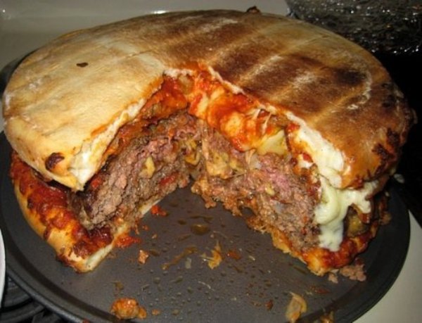 Bacon Cheese Pizza Burger. Sometimes you need to be reminded why you’re proud to be an American, and this is the pizza to jog your memory. Between two large meat pizzas sits a five pound beef burger topped with bacon and a blend of cheeses.