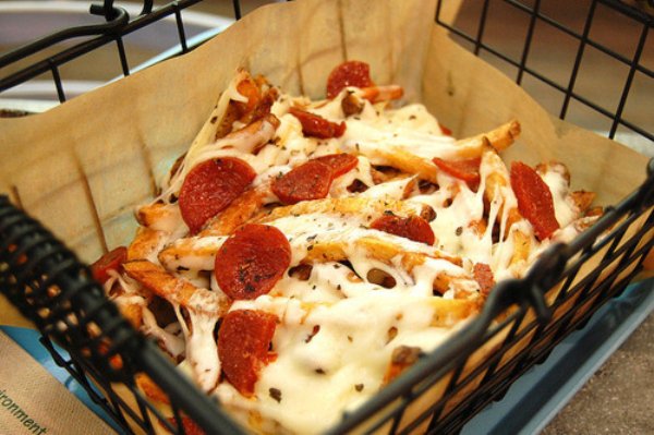 Pizza Fries. Take your love of fries and step up the game by adding pizza toppings & melted cheese