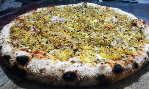 Banana Curry Pizza from Sweden. This pizza is topped with peanuts, bananas, chicken, pineapple and a boatload of curry powder which will leave your brain melted