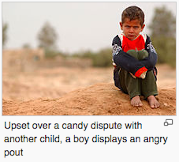 wikipedia caption - Upset over a candy dispute with another child, a boy displays an angry pout