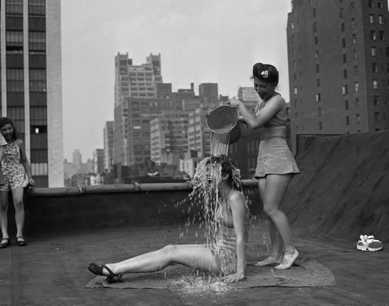 Trying to stay cool in the summer, NYC, 1943.