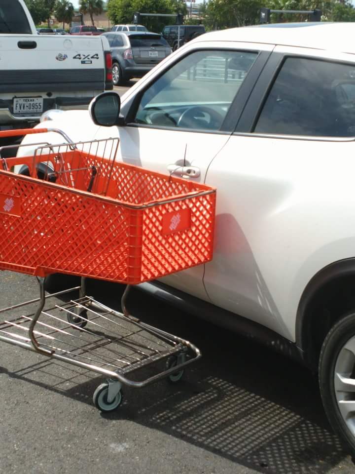 This car got only a cart parked by it. It could get its tires slashed or worse. You just need to push the cart and, WAIT...