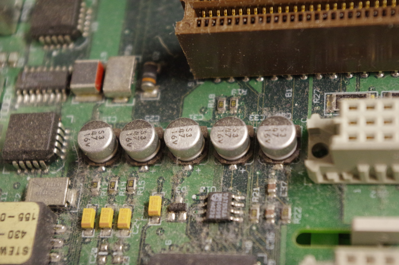"After pulling everything out and inspecting the motherboard, caps appear to be in good condition (or, at least, haven't started leaking yet).  Still considering whether a preemptive re-cap is appropriate."