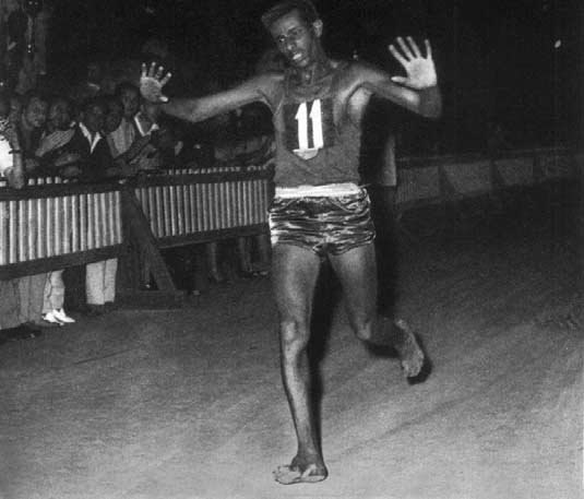 Bikila Abebe running in The Olympics, September 10 1960. As you can see someone stole his shoes. It was the Italian runner, but as he was involved with the mob, Bikila Abebe said "I won't press charges" as seen on this photo.
