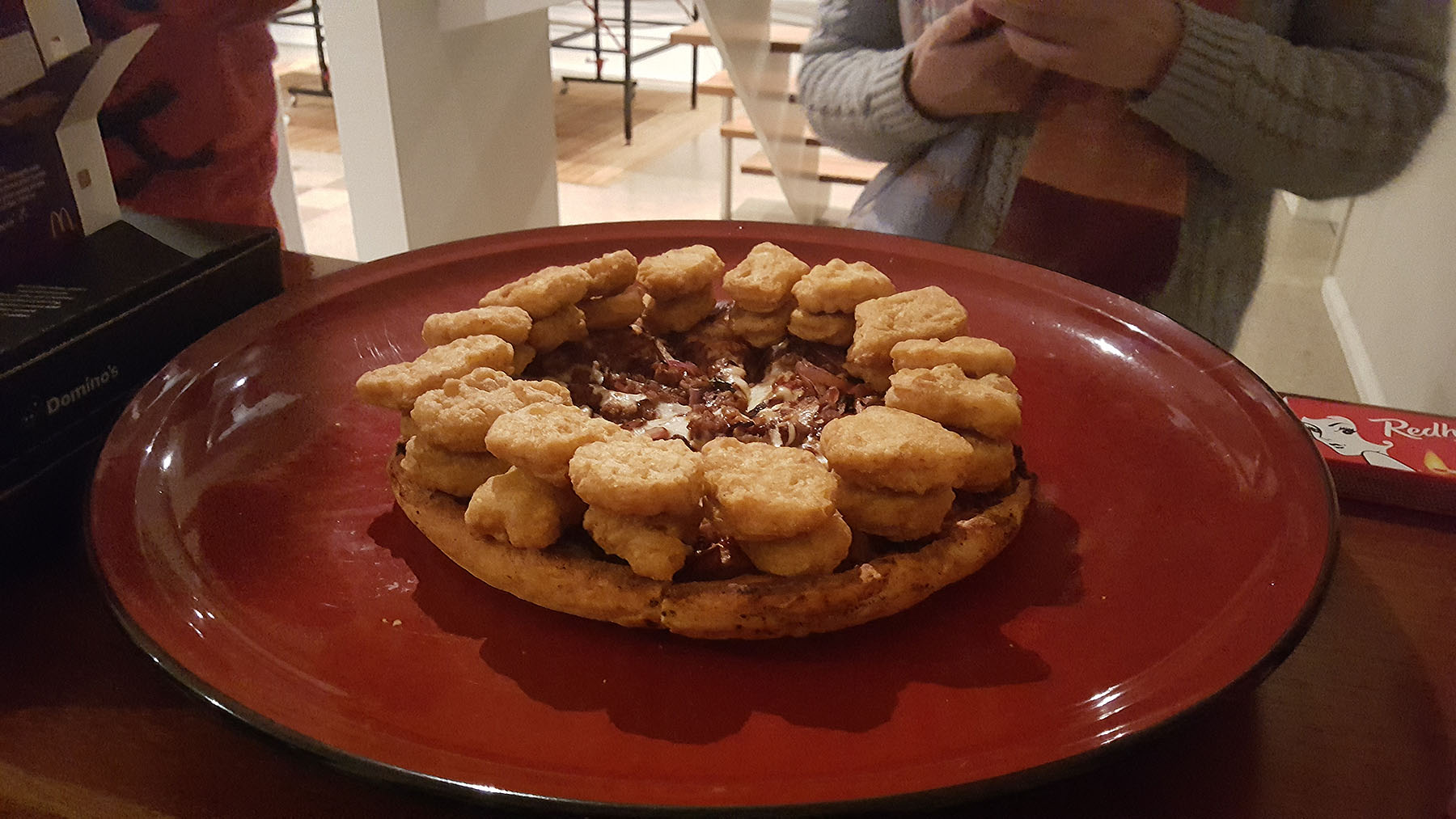 Step 2: Chicken nuggets as a second layer perimeter. It must kiss the crust edge for the best effect.