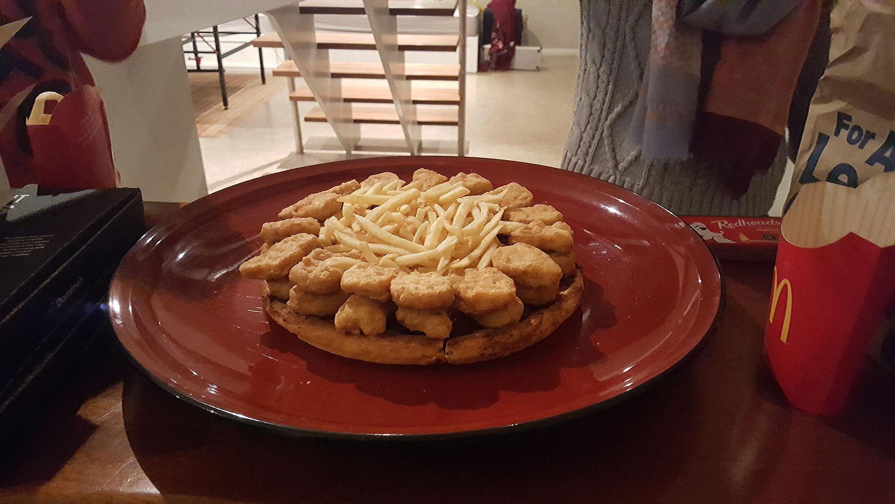 Step 3: Fill the chicken nugget fortress with fries. You want fries with that? You definitely do!