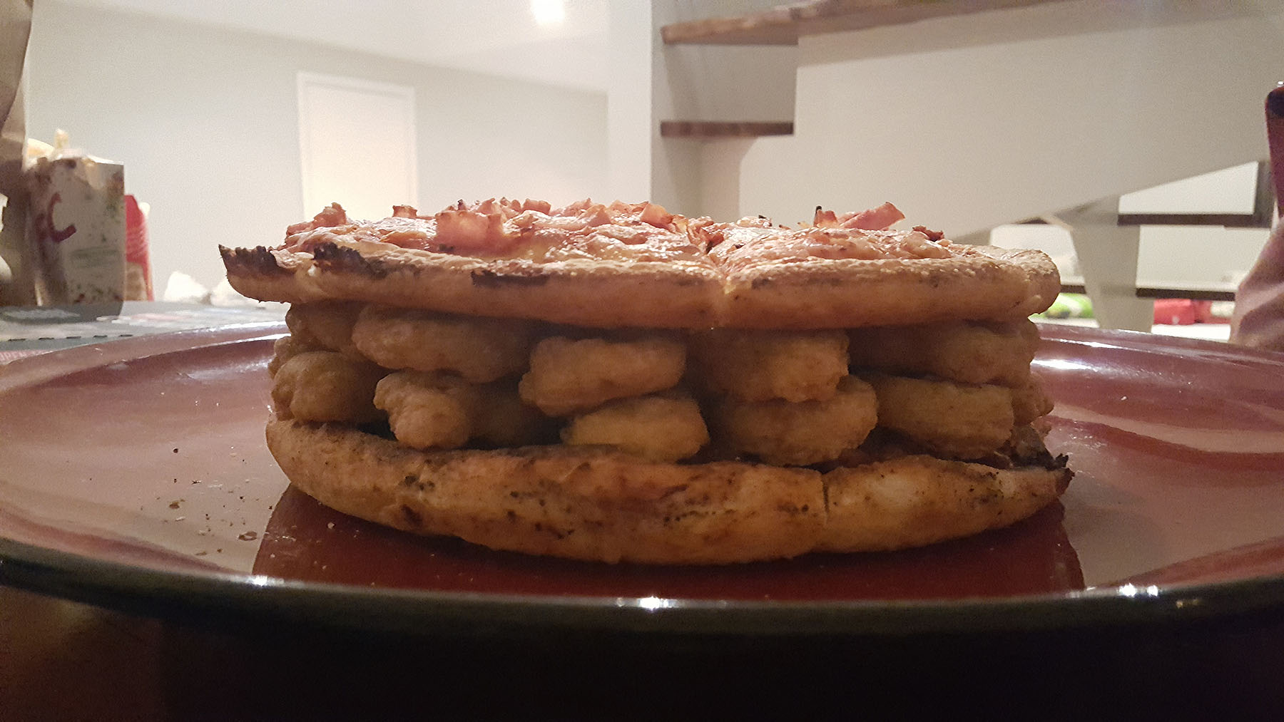 Step 4: Layer on the next pizza (normal pizza base) to help with the “tiered” cake look.