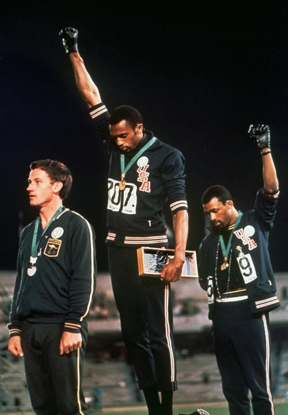 Amid a generation of conflict and racial divide, two American Olympians took to the winners podium after the 200-meter run and declared their protest for freedom and racial equality in the United States. Extending their gloved hands skyward, athletes Tommie Smith (center) and John Carlos stared downward as “The Star-Spangled Banner” played, just after Smith received the gold and Carlos the bronze at the 1968 Summer Olympic Games in Mexico City. Smith later explained, “They called it Black Power. I called it human power or cry for freedom.”. The silver medalist in photo is Australian Peter Norman, he suggested they share the black gloves and the three of them became lifelong friends; Smith and Carlos were actually pallbearers at his funeral.