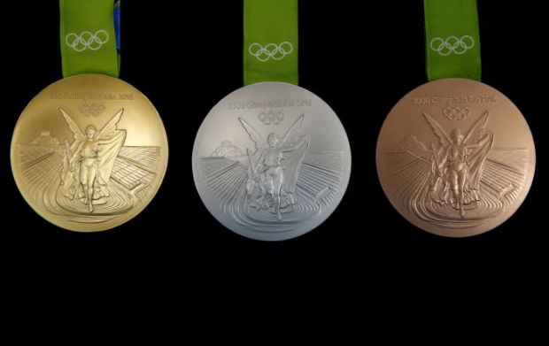 These are the Rio medals first thing you notice is they say what Olympic Games they come from. Yes. Every Games have their own medals. The coming photos will show you how the Rio medals are made, and will give you a little trivia.
