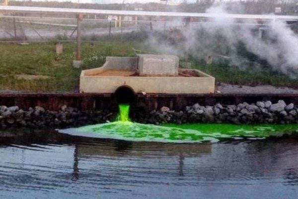 dumping chemicals into a river