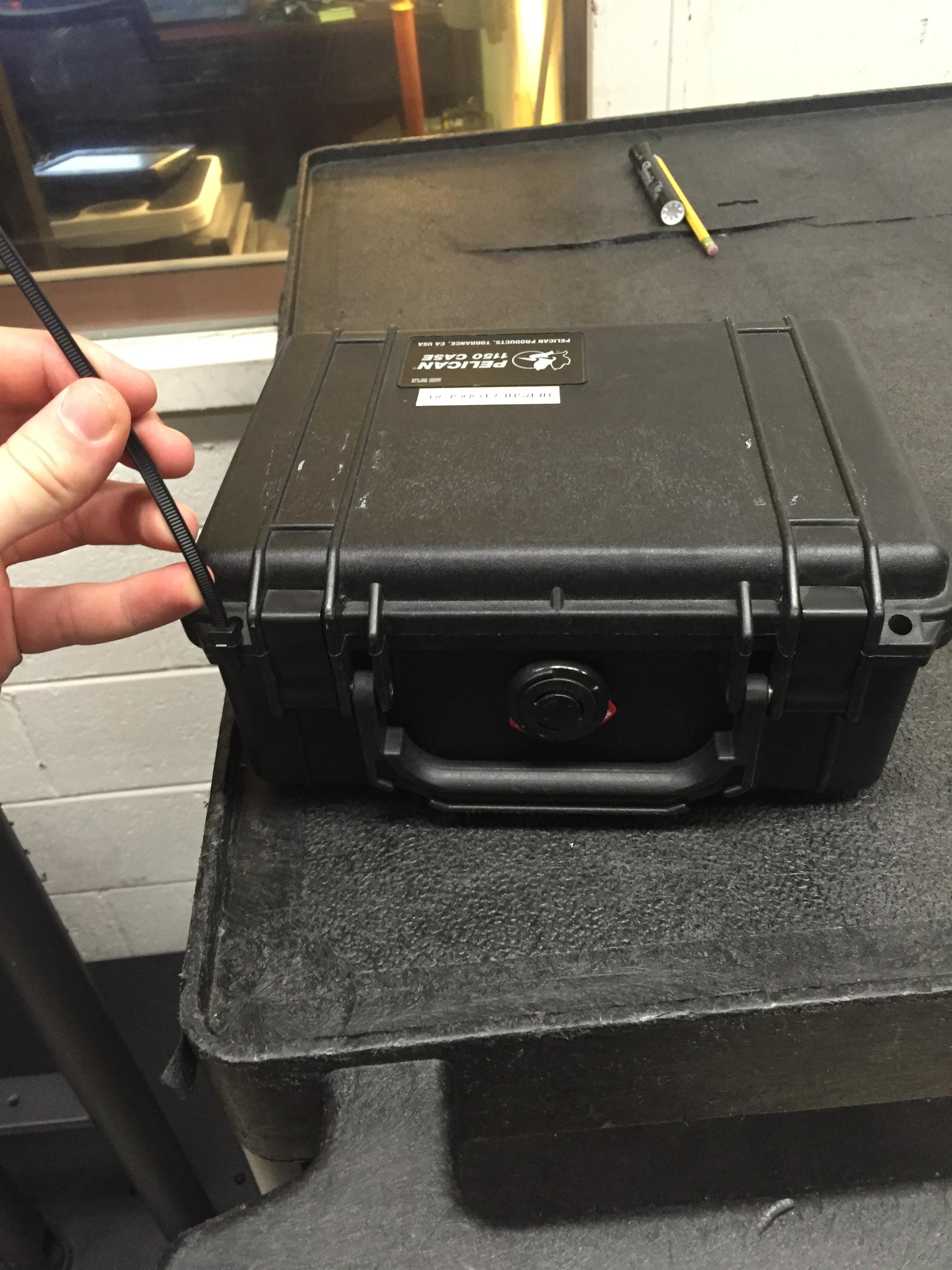 Put the leather bag in a pelican case with a zip tie for safety,  the next step was wrapping the pelican case airtight with shrink wrap.