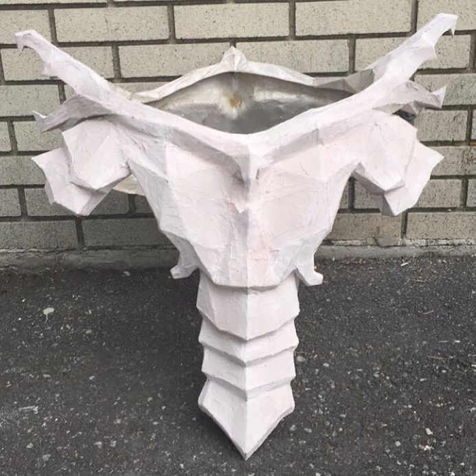 "This was taken in the midst of the bondo-sand-repeat process. I planned on detailing the entire cuirass with EVA foam, so the bondo-job didn't have to be perfect like the mask, but it still took a lot of elbow grease."