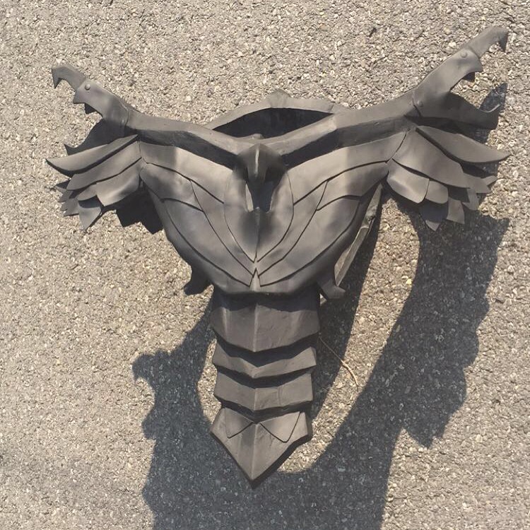 "Here's the detailed and primed cuirass. All the lines that you see on the chest/shoulders are layered EVA foam (3mm and 5mm).  Also, I used Dap Kwik Seal to hide the seams down the center. I would highly recommend this method for hiding foam seams!"