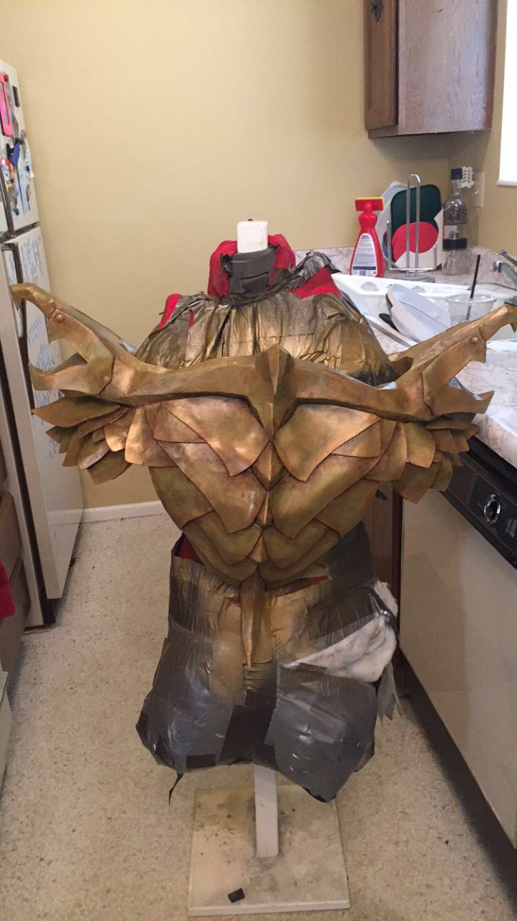 "Here's one of the only photos I have that actually shows the rusty green/dirtiness of the armor. The metallic gold spray paint I used for the base coat washes out the detailing in photographs unfortunately, but not in person, at least!"