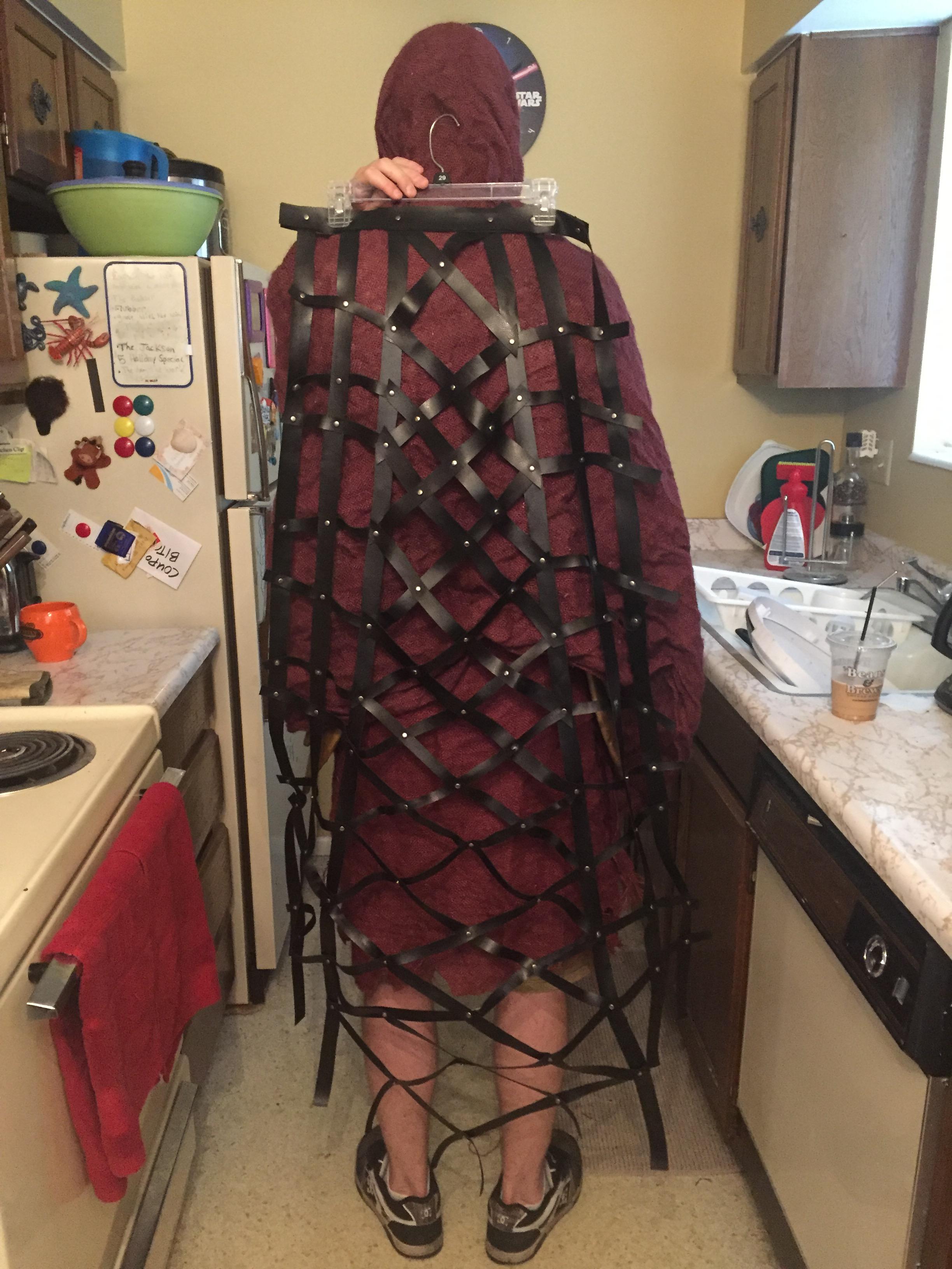 "Elling actually made this! He got so into it, too (I think he's hooked). This is just black vinyl strips, a bajillion rivets, and a simple wire framework to help maintain the lattice shape. I eventually glued this to the inside of the cuirass."