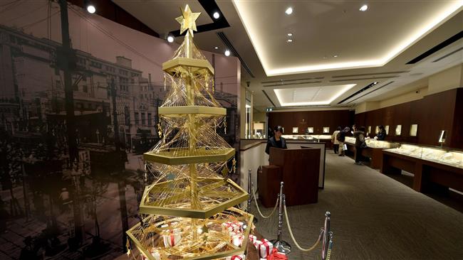 The gold Christmas tree went on sale after being unveiled at a jewellery store in downtown Tokyo yesterday. The 42 pound tree is decorated with gold wire and stands 6.6 feet high at the Ginza Tanaka store. The tree gained world wide attention and immediately became a tourist attraction.