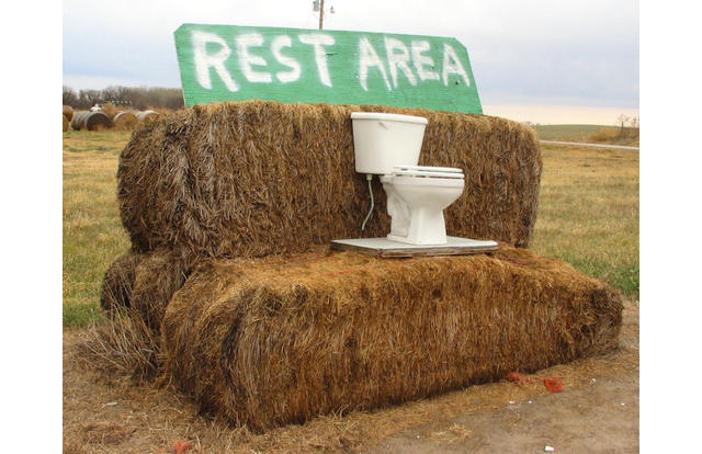 Toilet on bail of hay rest area in Nebraska