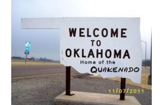 Welcome to Oklahoma sign home of the Quakenado