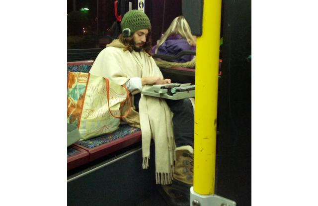 Wizard on a typewriter on the bus in Oregon