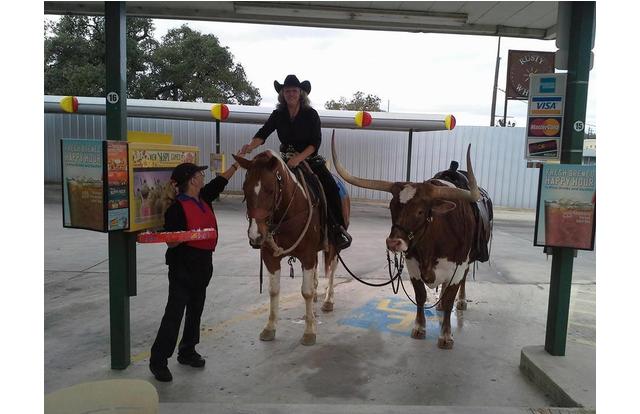 Man riding a horse to a drive-thru in Texas.