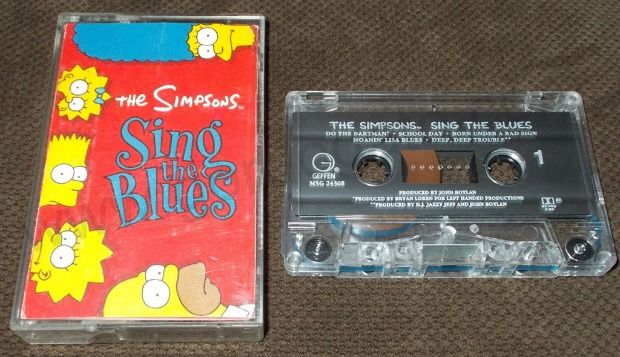 compact cassette - The Simpsons The Simpsons Sing The Blues Do The Batman Cool Day Born Under Arad Slun Moane Lisa Blue Deep, Deep Thout Sing Geffen Blues Troduced Byrjalt Ardon Wilas