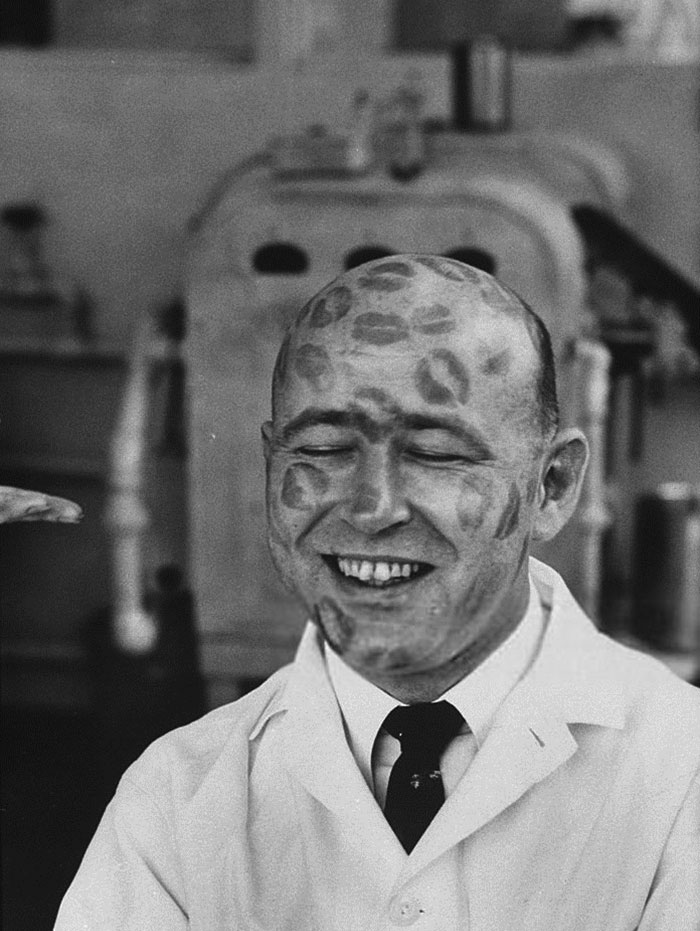 Guy testing lipsticks, 1950s.