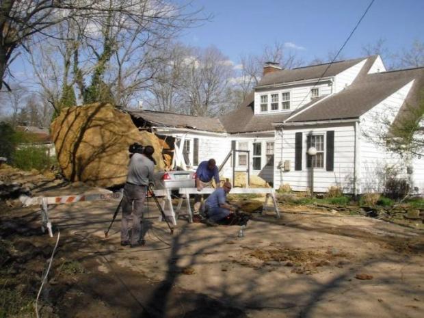 The rock measuring 25 feet in diameter tore loose because of recent heavy rains and the growth of tree roots.