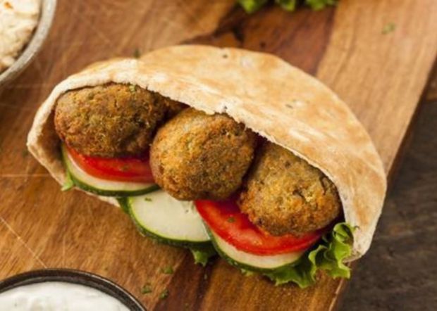 Israel. Moviegoers enjoy balls made from ground chickpeas. This popular snack is commonly served in a pita, which acts as a pocket.