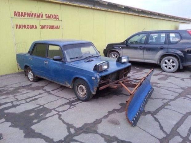 russia - car with snow shovel attached to it