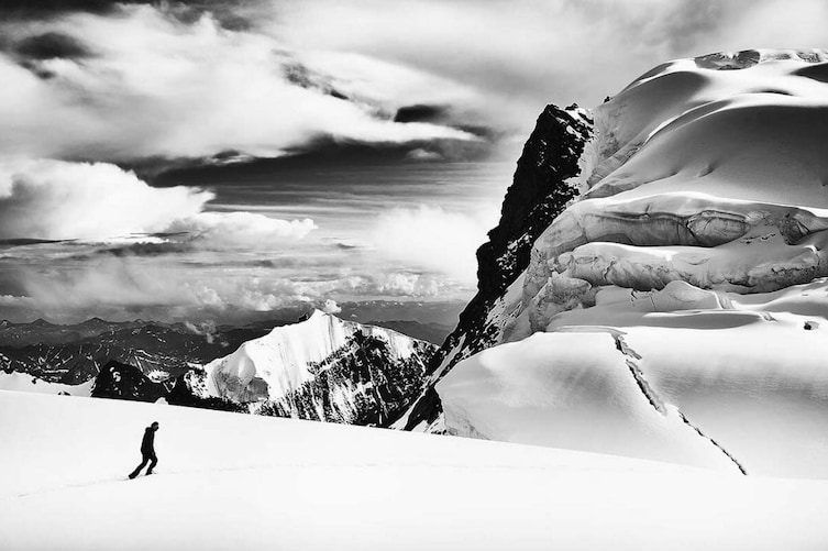 A mountain climber trudges through the snow on Mount Belukha in Russia.   Open Nature category.