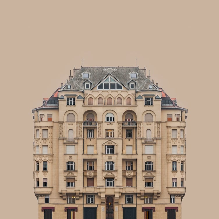 A reflected vision appearing to be a perfectly symmetrical building, on the banks of the Danube River.  Professional Architecture category.