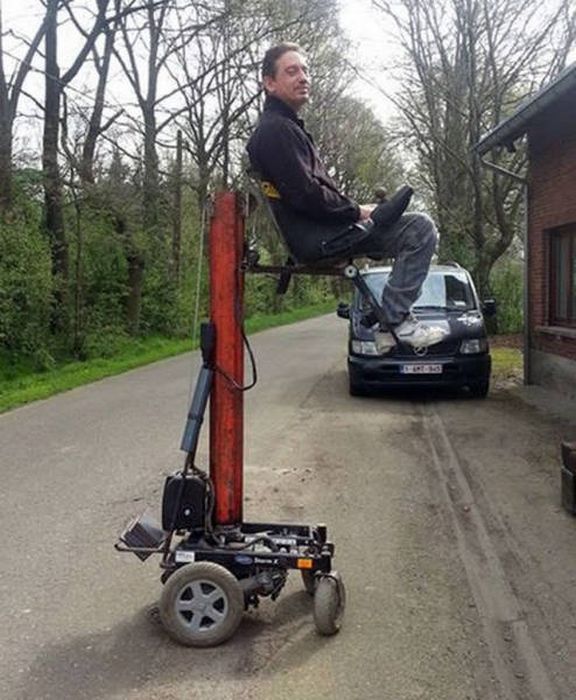 wtf forklift lifting a wheelchair