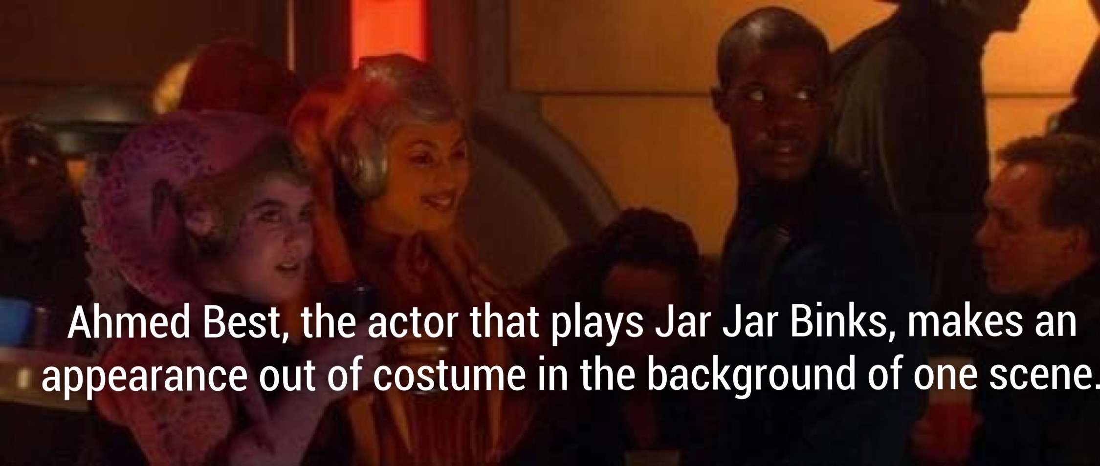 photo caption - Ahmed Best, the actor that plays Jar Jar Binks, makes an appearance out of costume in the background of one scene,