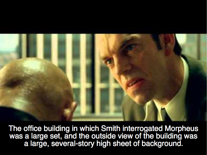 photo caption - The office building in which Smith interrogated Morpheus was a large set, and the outside view of the building was a large, severalstory high sheet of background.
