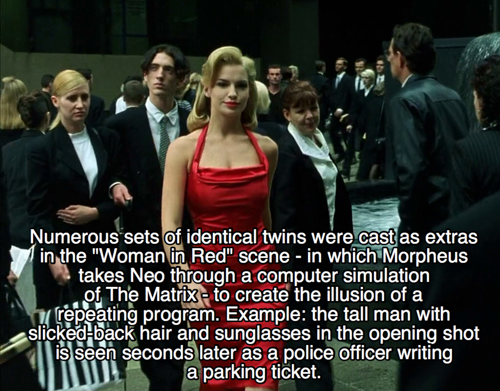 woman in the red dress - Numerous sets of identical twins were cast as extras in the "Woman in Red" scene in which Morpheus takes Neo through a computer simulation of The Matrix to create the illusion of a repeating program. Example the tall man with slic
