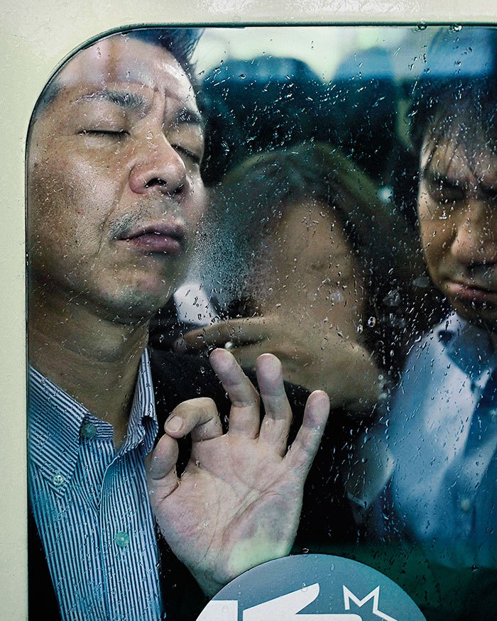 Photographer Michael Wolf comes from Germany but lives in Tokyo. He takes photos of overcrowded subway trains. Is this guy ok? Oh, he is.