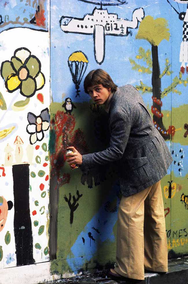 Mark Hamill adding to a children's mural for a magazine shoot in London in 1979.