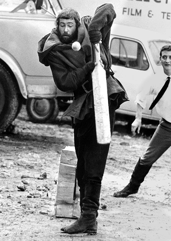 Peter O'Toole playing cricket while still in costume in between scenes of the film The Lion in Winter in 1968.
