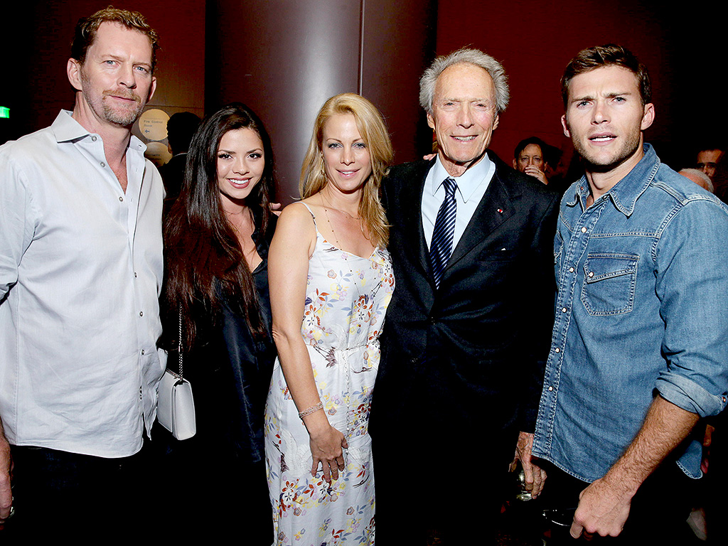 Clint Eastwood with 3 of his 8 (yes 8) children at an event in 2013. Even better he has had them with 6 different women. Oh, and only 3 of his children came from when he was married, which he has been twice. The Eastwood crew pictured here is Scott Eastwood on the right, Allison Eastwood center, and Morgan Eastwood center left. The man on the left is Allison Eastwoods husband Stacy Poitras.