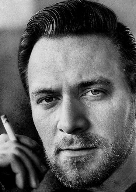 Christopher Plummer smoking a cigarette for a headshot in the late 1950s. Some people note the resemblance of the young Plummer to Michael Fassbender or James McAvoy, or a weird hybrid of both.
