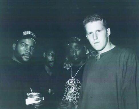Ice Cube, John Singleton, 2Pac and Michael Rapaport hanging out at a club in 1994 (hence the grainy night vision picture). Singleton was working with Ice Cube and Rapaport on the film Higher Learning at the time.