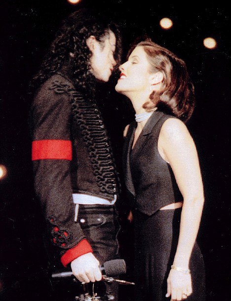 Michael Jackson about to kiss his wife Lisa Marie Presley after a performance at the 1994 MTV Music Awards. The 2 were married for just 2 years, ending in 1996.