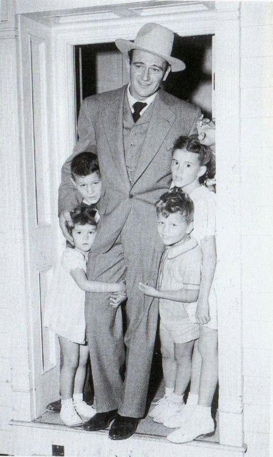 John Wayne with 4 of his 7 children at his home in 1943.