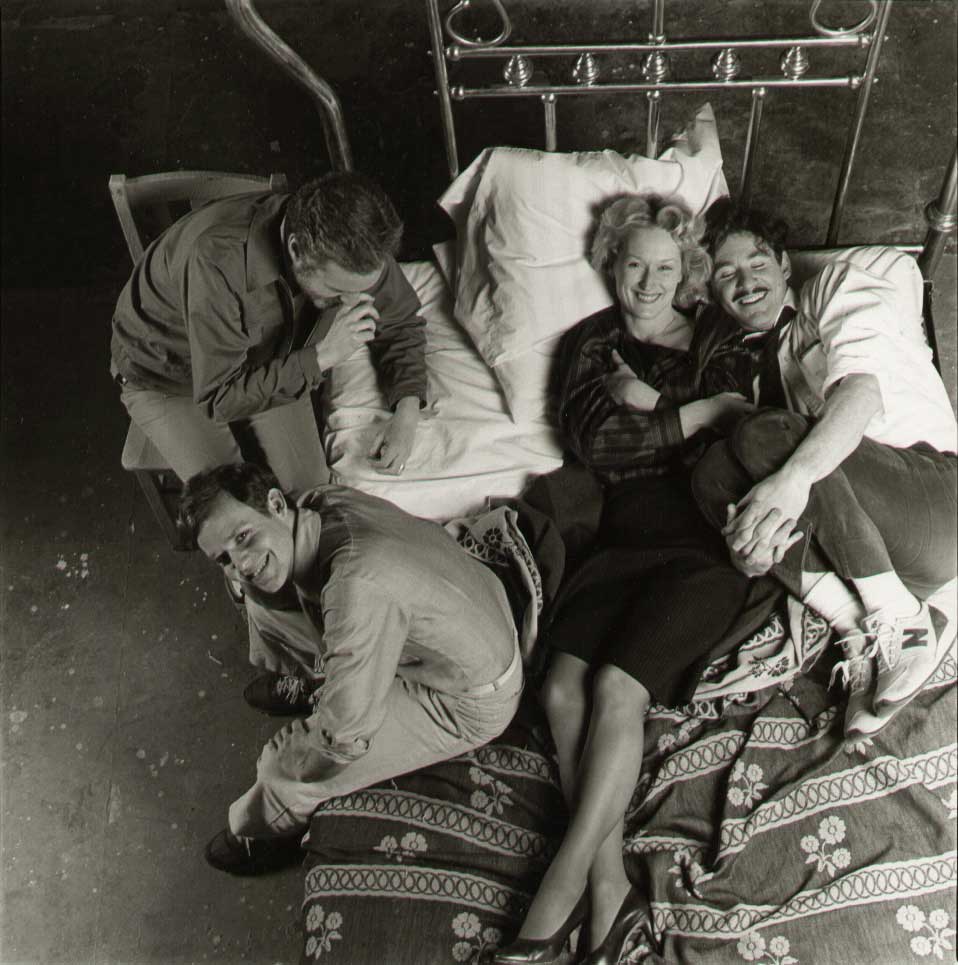 Alan J. Pakula, Peter MacNicol, Meryl Streep and Kevin Kline pose for a fun picture before a scene for the incredibly sad and powerful film Sophie's Choice in 1982. The crew were close during filming and Kline and Streep remained friends. Apparently they tried to have some fun during filming to ensure the mood stayed positive despite the subject matter of the film.