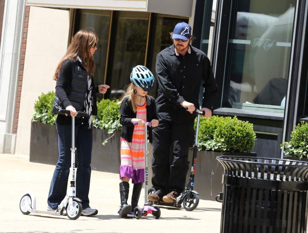 Christian Bale with his wife Sibi Blazic and daughter in Boston in 2013. The couple have been married since 2000 and have 2 children. The family is quite close, going on trips and he has even brought them with him on some of his film projects when he has to travel. Bale's reputation as difficult and mean in his method acting and work caused by publicized incidents is well known, but people may not know how active and engaged a family man he always has been.