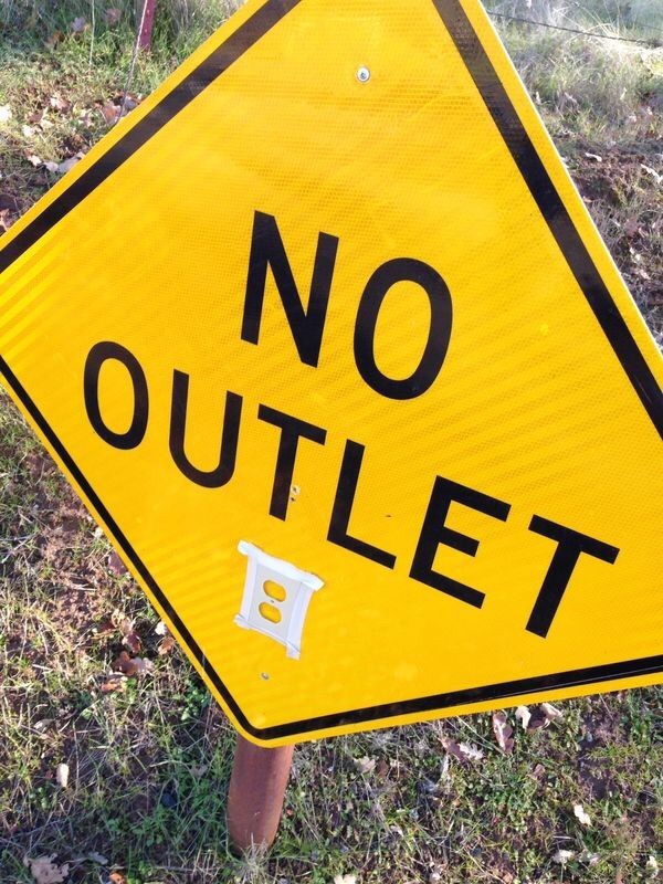 Outlet installed onto a sign saying NO OUTLET