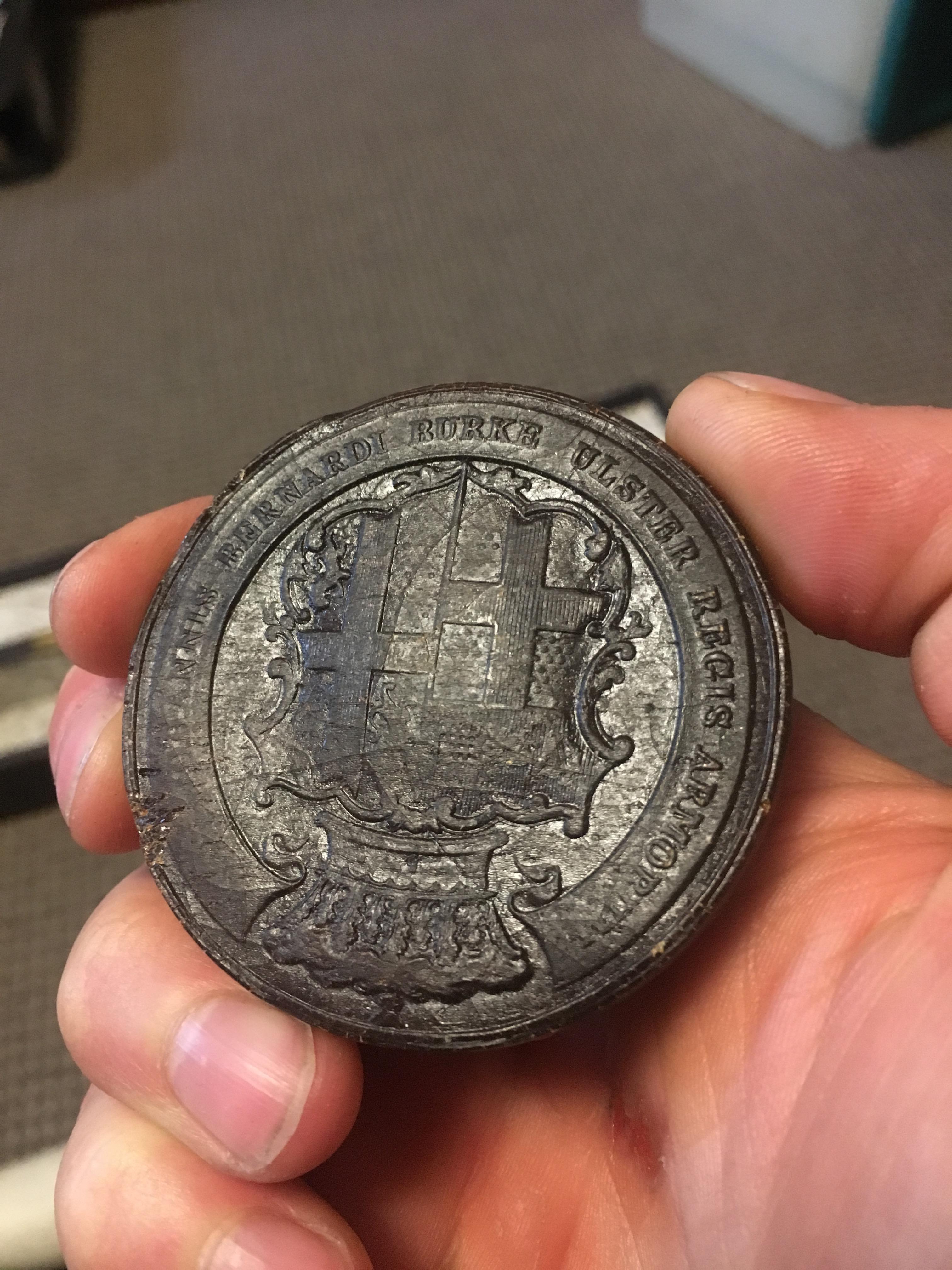 Close up on the seal, held in hand.