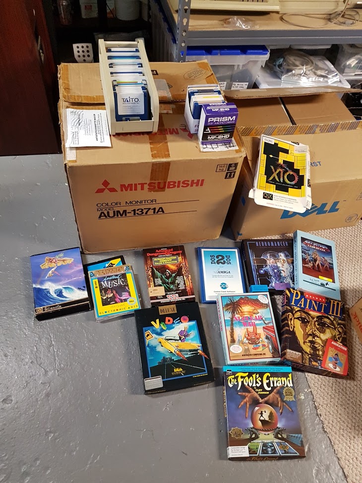 "Starting to sort through the stuff. Came with some boxed games and various discs."